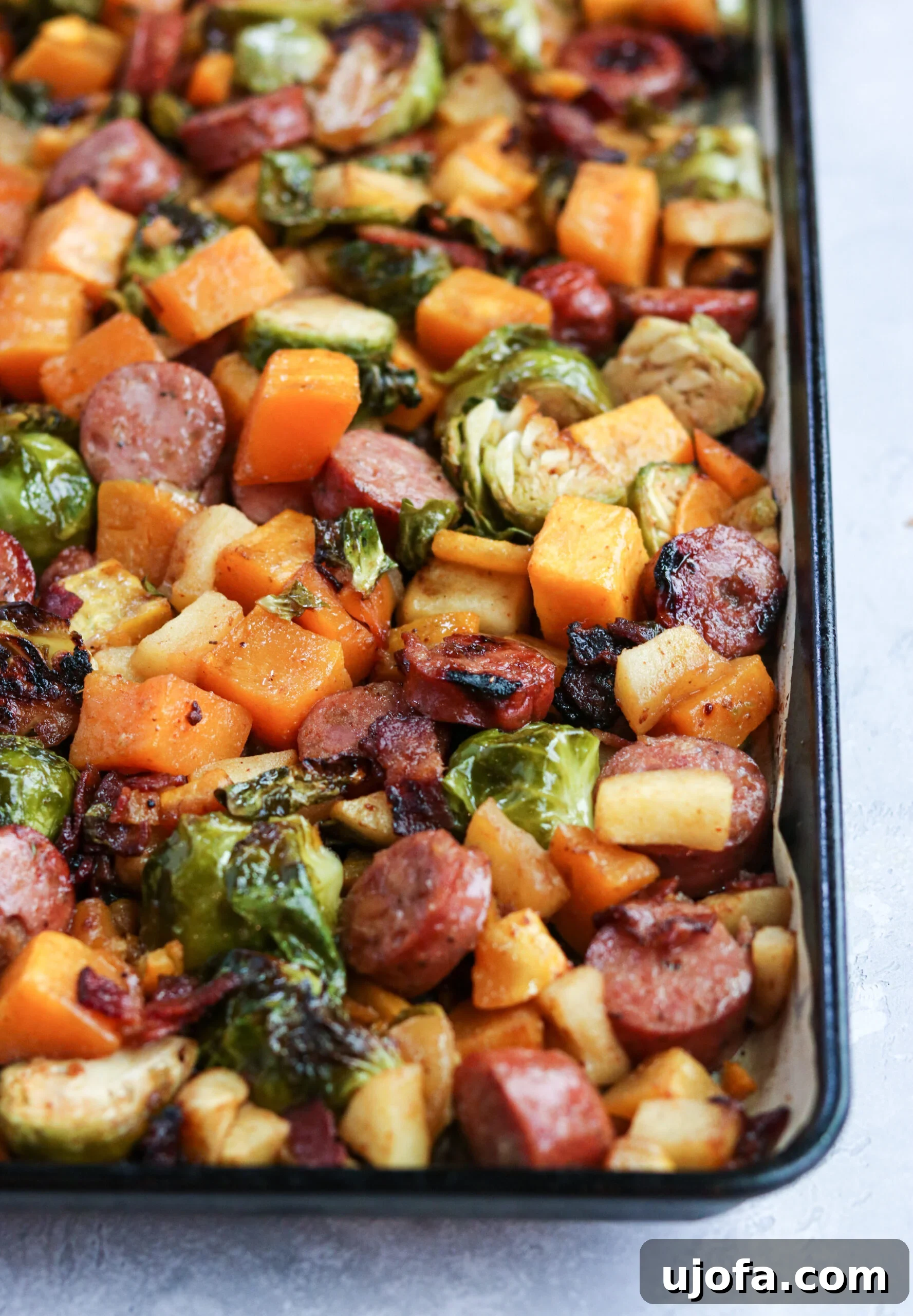 Another overhead shot of the Whole30 Harvest Sheet Pan Dinner, showcasing the vibrant colors and appealing texture of the roasted ingredients.