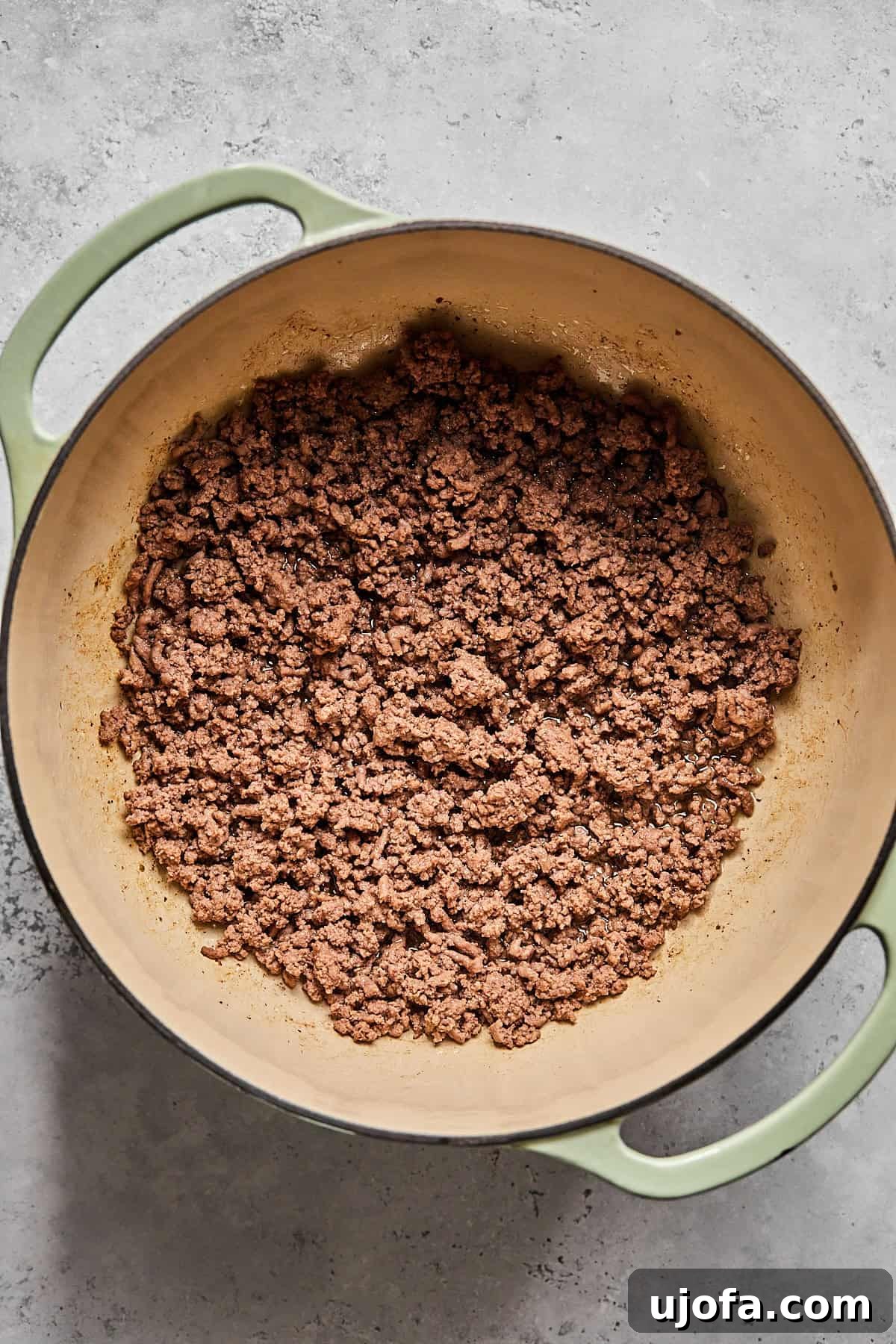 Creamy Dairy-Free Bacon Cheeseburger Soup 5 Well-browned ground beef cooking in a large pot, ready to be removed with a slotted spoon.