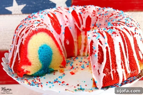 Closeup of the Gluten-Free Firecracker Almond Bundt Cake showcasing its moist crumb and vibrant red, white, and blue layers, ideal for patriotic gatherings.