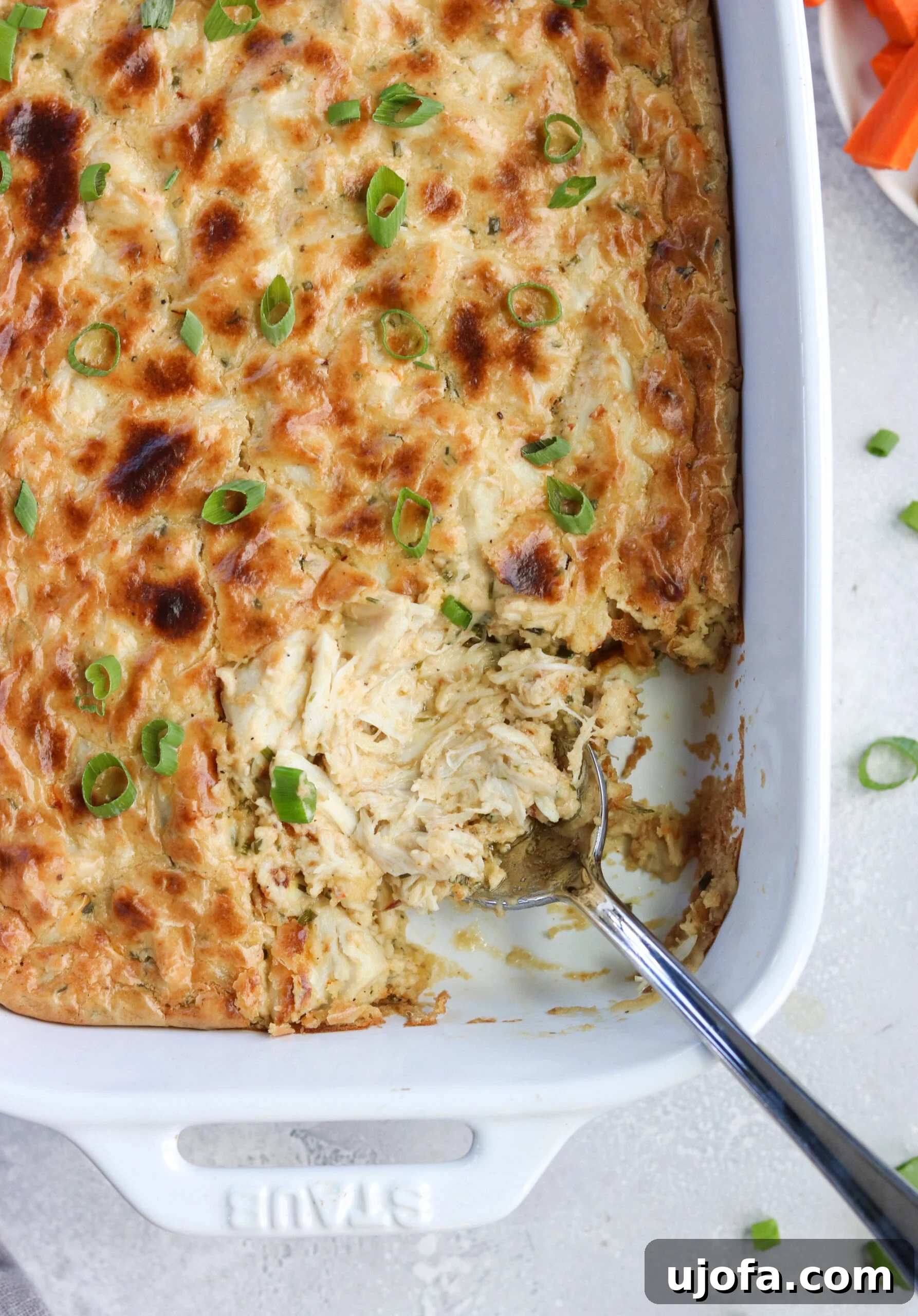 Paleo Maryland Crab Dip - A delicious dairy-free and gluten-free version of the classic appetizer, garnished and ready to serve.