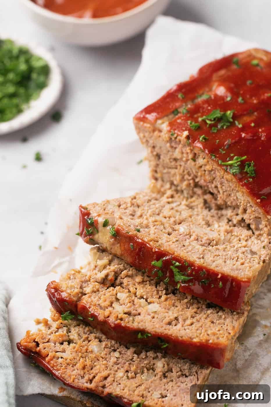 gluten free meatloaf topped with parsley and sliced