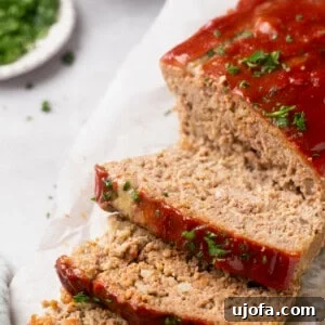 gluten free meatloaf topped with parsley and sliced