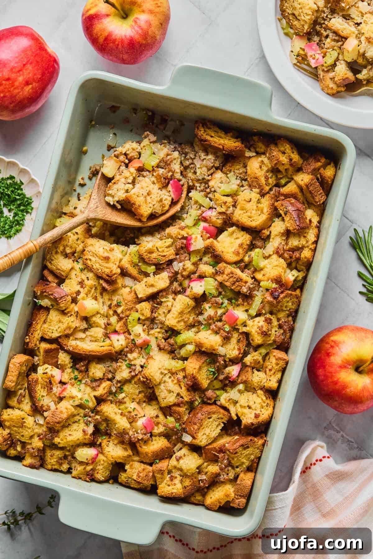 Your New Favorite Gluten Free and Dairy Free Stuffing 2 savory sausage apple herb stuffing in a blue casserole dish