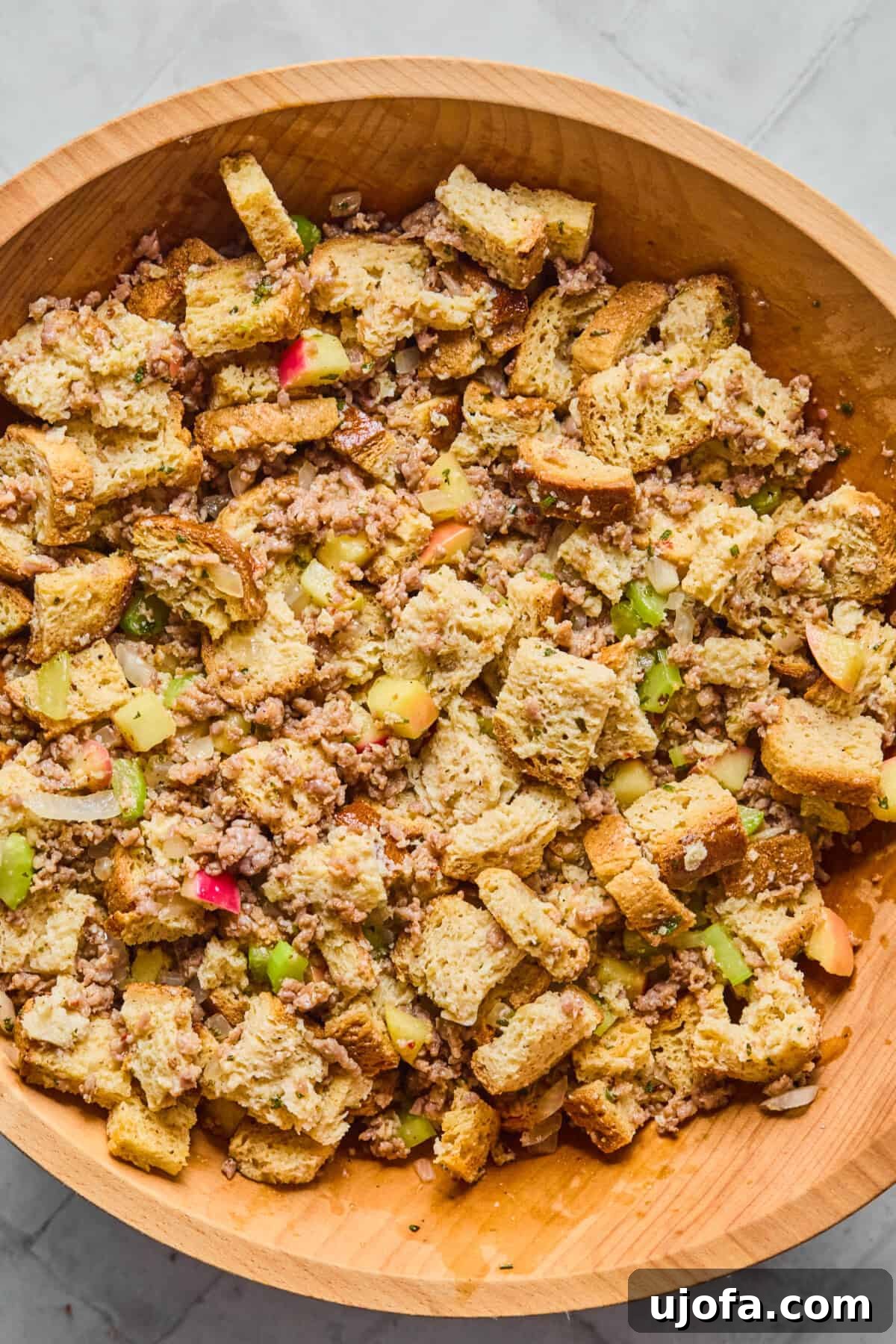 Your New Favorite Gluten Free and Dairy Free Stuffing 8 sausage, bread, celery, apples, herbs and broth in a bowl