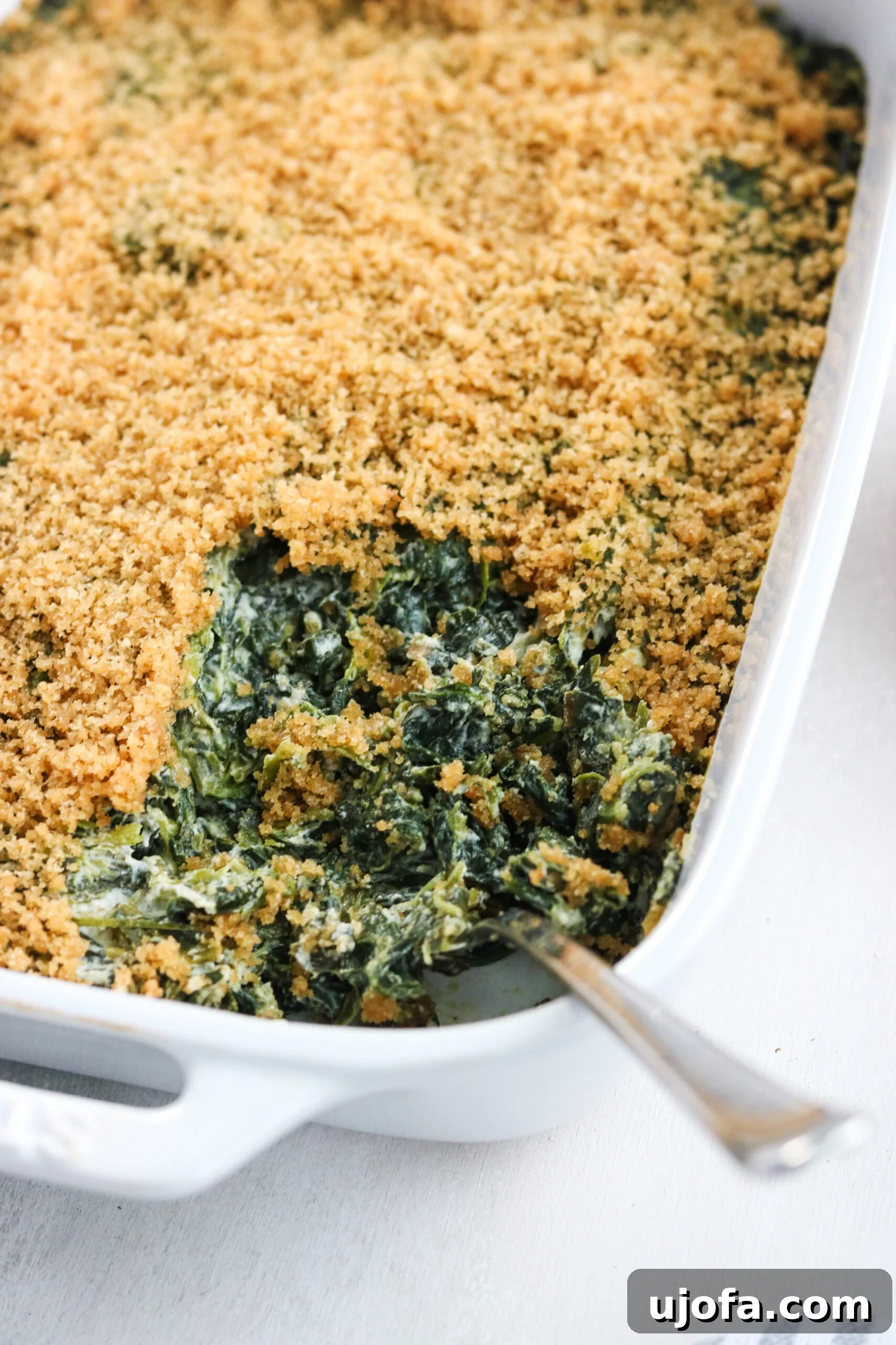Dreamy Dairy-Free Paleo Spinach Bake 5 Dairy free spinach casserole with serving spoon