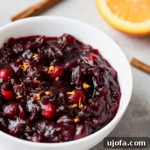Bright and zesty Paleo Orange Cranberry Sauce in a festive serving bowl