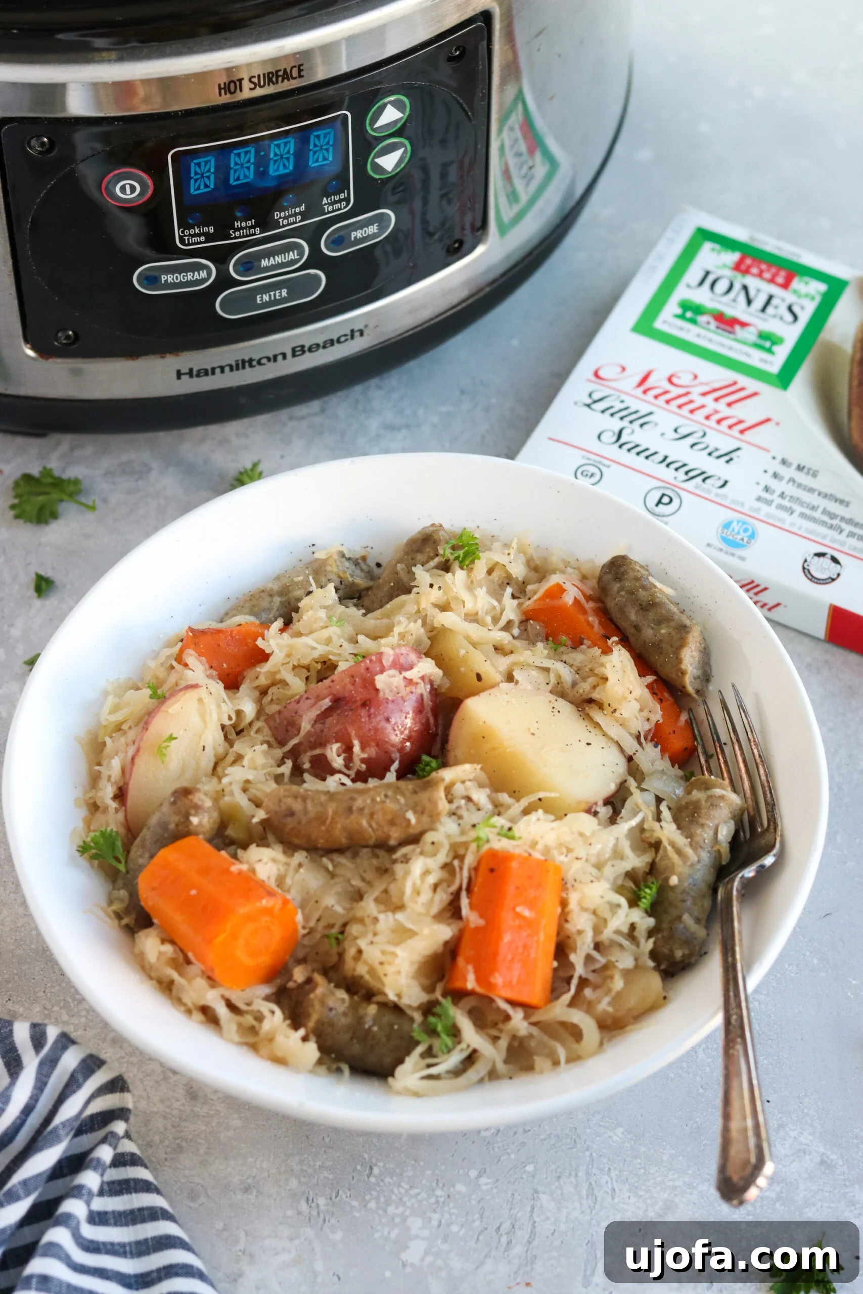 Slow Cooker Sausage, Sauerkraut, and Apples in a crock pot