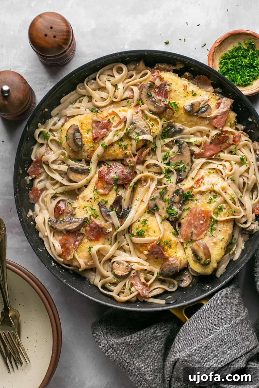 Quick Chicken Marsala Fettuccine with Crispy Prosciutto 6 a skillet with fettucine and chicken marsala topped with parsley