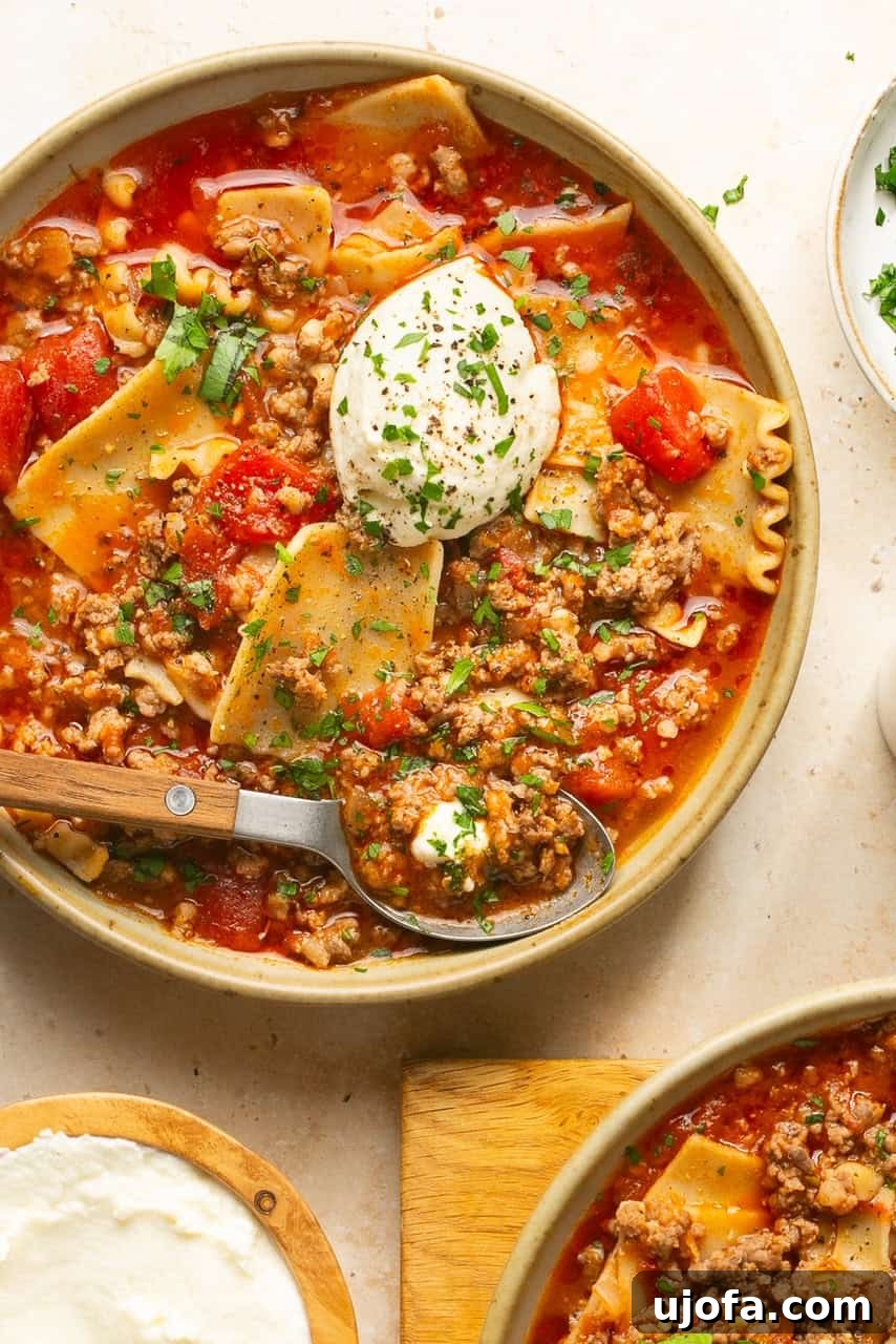 An inviting overhead shot of a large pot filled to the brim with hearty gluten-free lasagna soup, ready to be served.