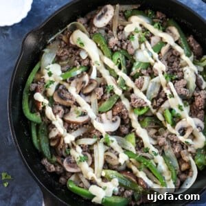 Prepared Whole30 Philly Cheesesteak Skillet with creamy cashew cheese sauce ready to serve.