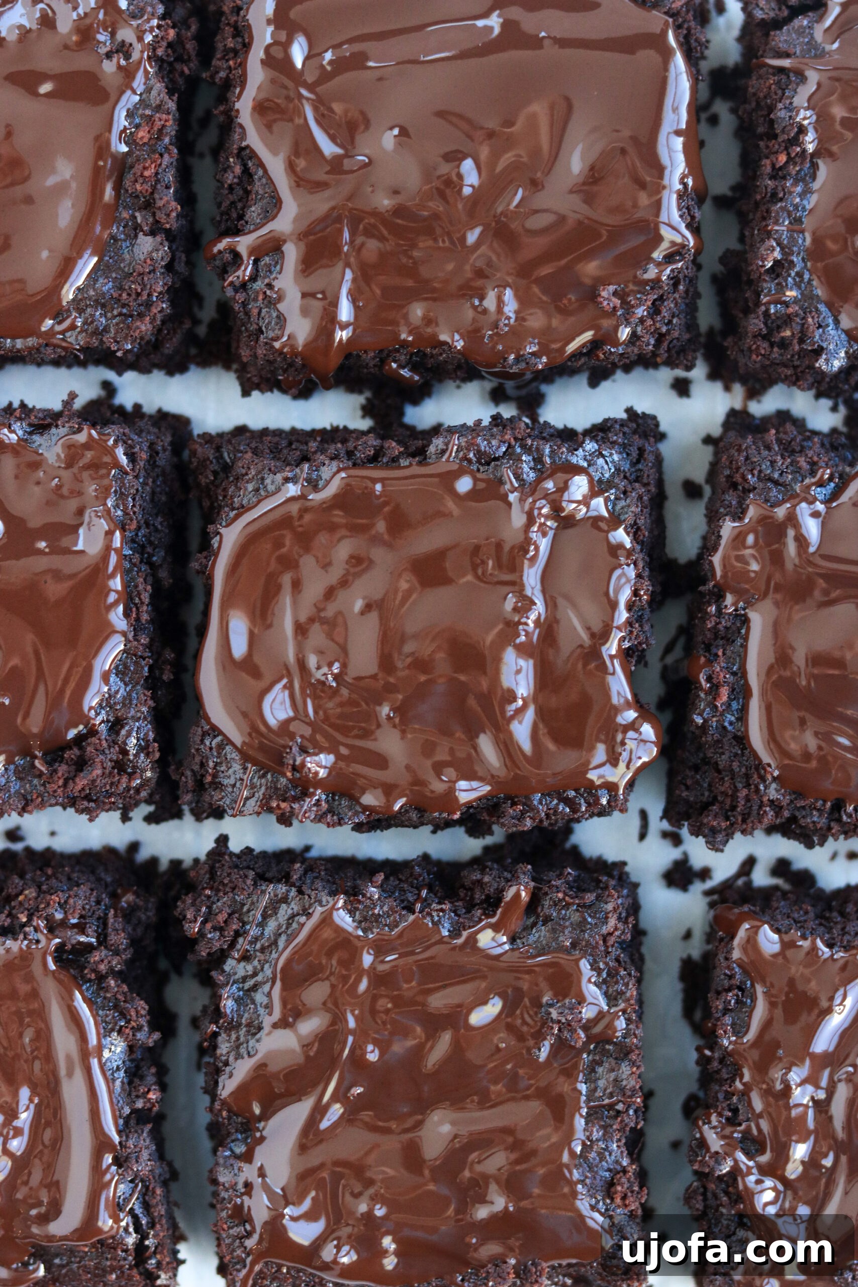 close-up of chocolate brownies in a baking pan, showing the rich, dark color and shiny surface