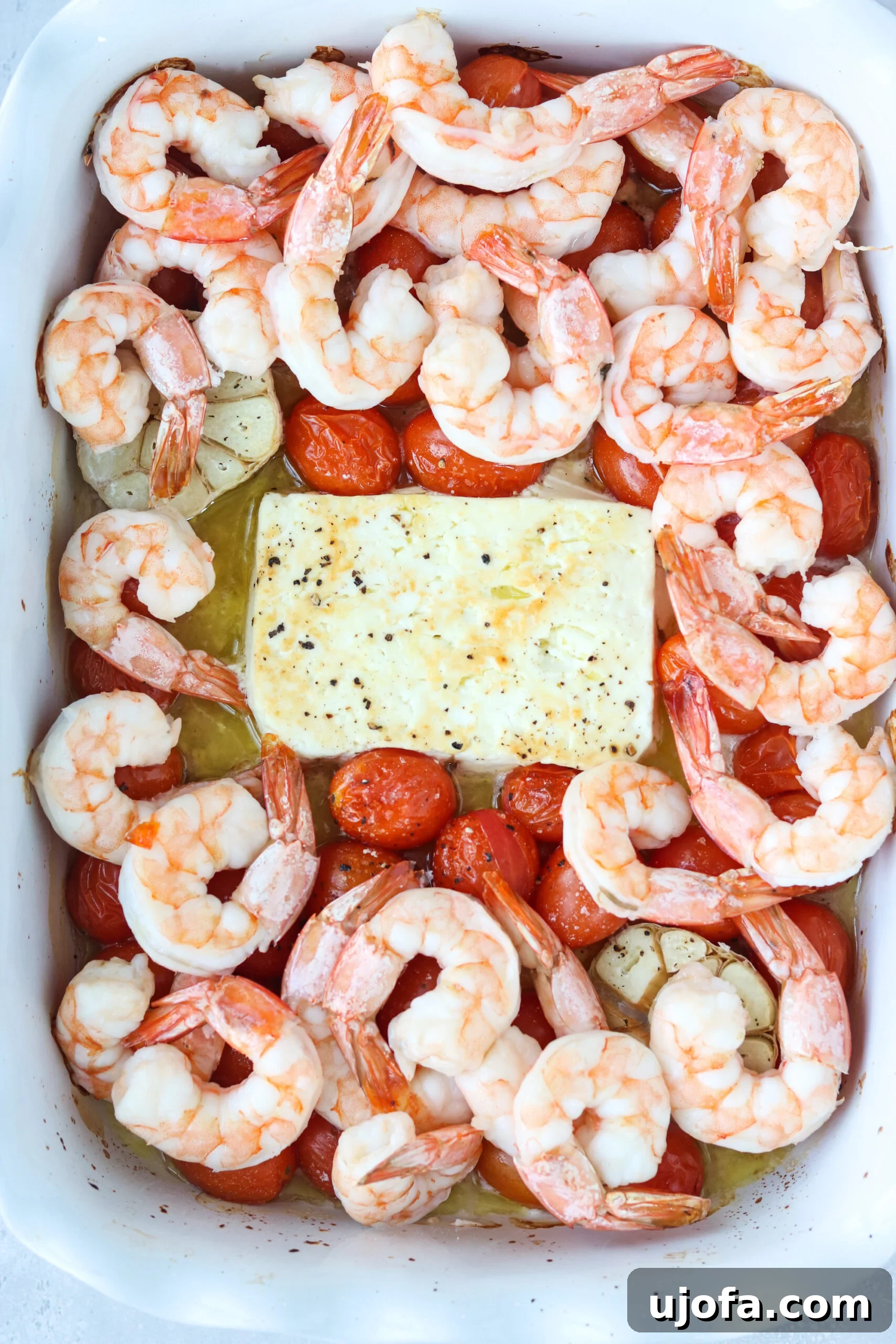 Ingredients for baked feta pasta with shrimp spread out on a counter