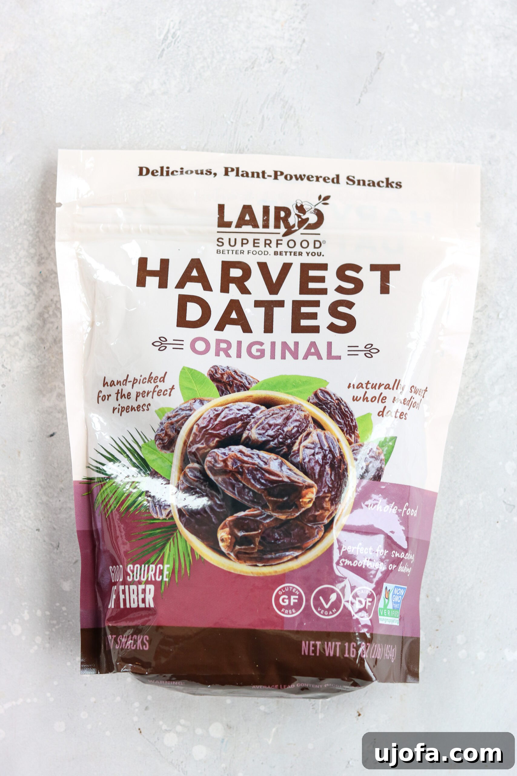 Laird Superfood Harvest Dates Close-up image of a handful of plump, juicy Laird Superfood Harvest Dates, highlighting their rich color and texture.