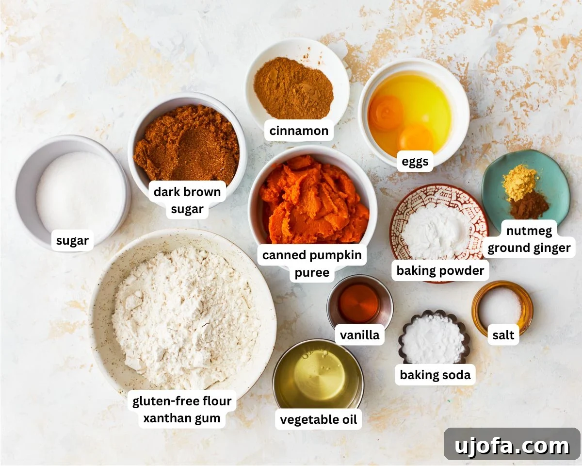 Wholesome Gluten-Free Pumpkin Delights 3 A selection of fresh ingredients including gluten-free flour, pumpkin puree, spices, and eggs, arranged for making gluten-free pumpkin muffins.