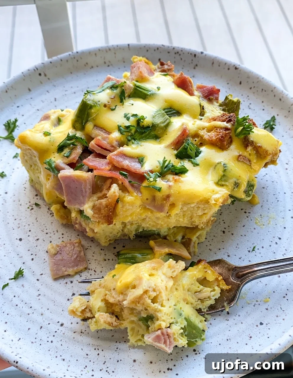 Gluten Free Overnight Eggs Benedict Casserole and a forka