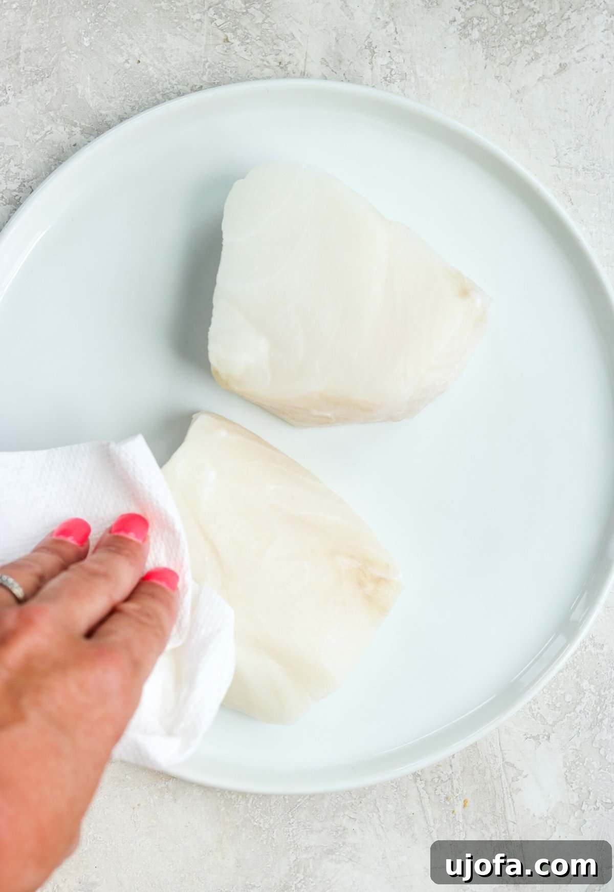 20-Minute Chilean Sea Bass with Bright Lemon Caper Butter 4 Blotting moisture from sea bass fillet with paper towel to ensure a crispy sear.