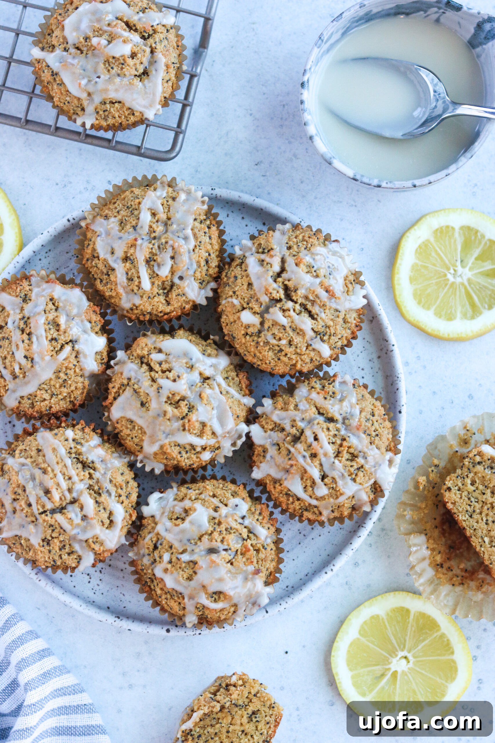 Muffins on a plate with lemon slices surrounding them