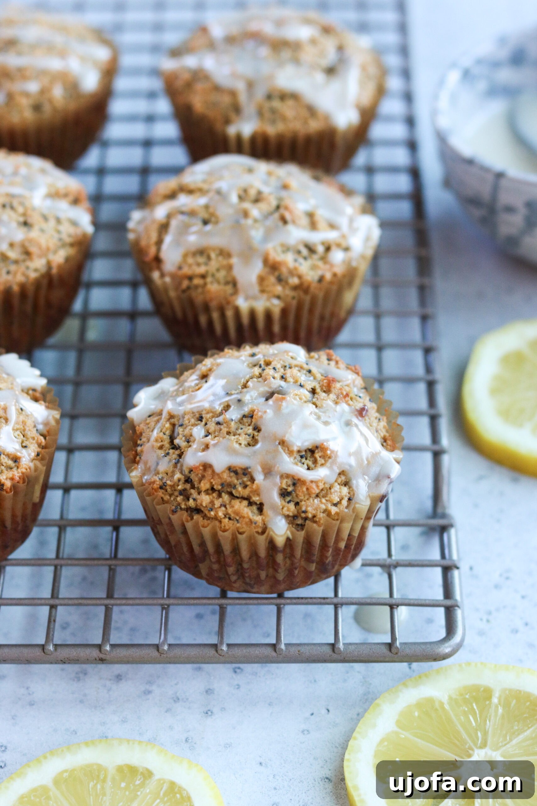 Cupcakes and fresh lemons on a rustic table setting