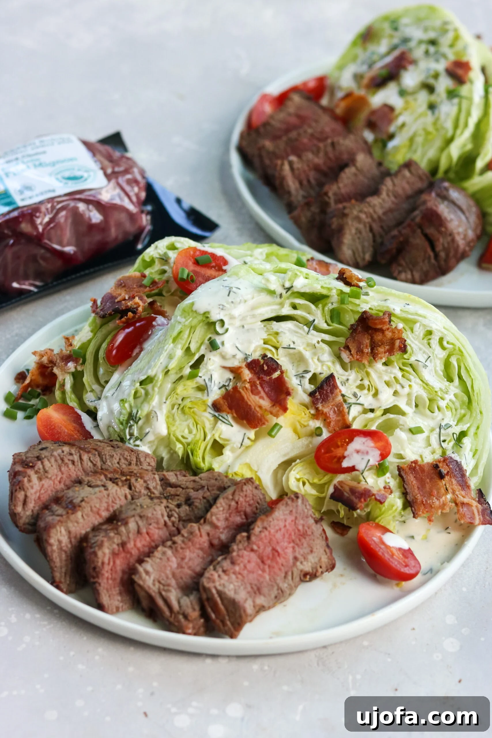 Assembled Wedge Salad with Filet and Dairy-Free Ranch Gluten-free wedge salad with grilled filet, showcasing fresh ingredients and sliced steak ready to serve.