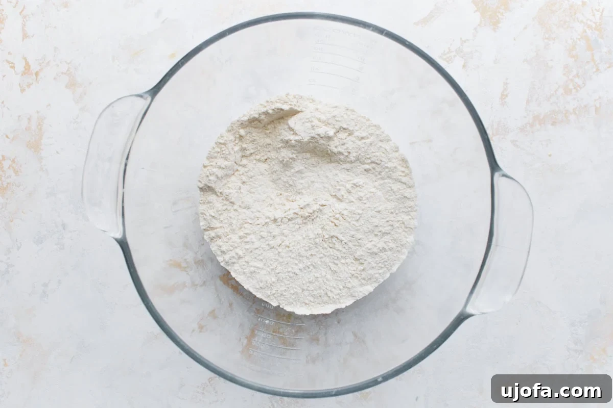 Mixing bowl with gluten-free flour and salt, with a small well for yeast