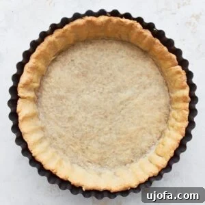 Overhead view of a gluten-free pie crust in a pie pan.