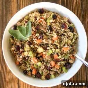 Savory Sausage and Cauliflower Rice Stuffing Whole30 Keto Paleo 4 A beautifully plated dish of Riced Cauliflower Stuffing with Sausage, garnished with fresh herbs, ready to serve.