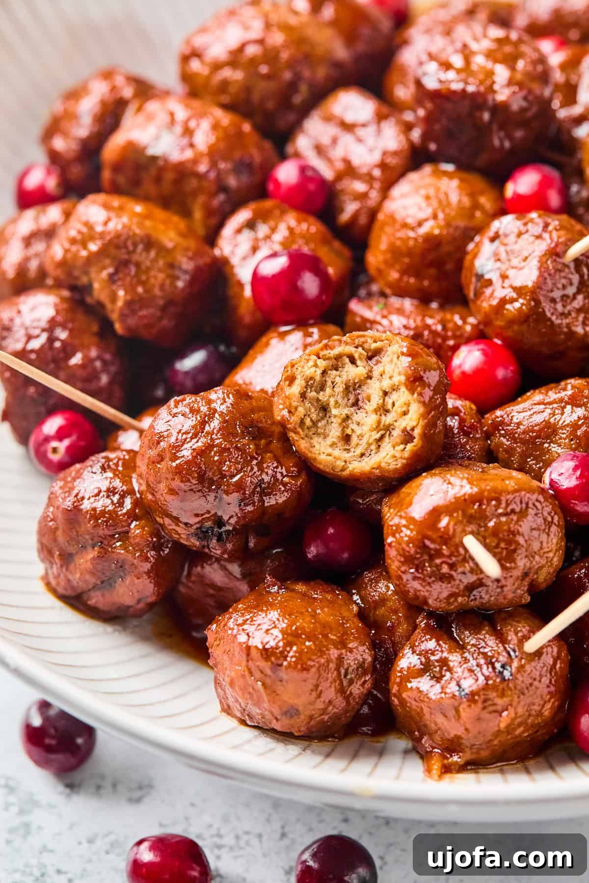 a meatball cut in half to show the center 