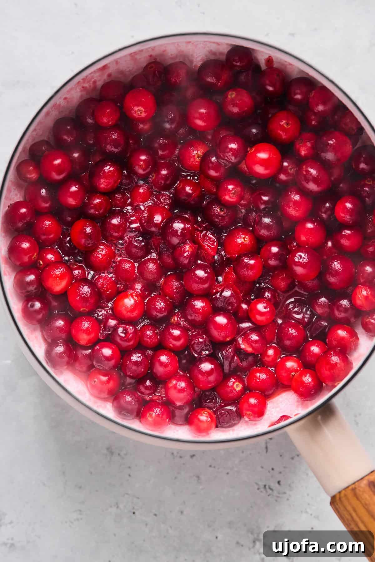 whole cranberries in a saucepan