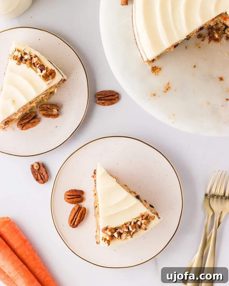 Top view of several slices of gluten-free carrot cake arranged on plates, surrounded by scattered pecans and whole carrots, with golden forks placed next to the plates.