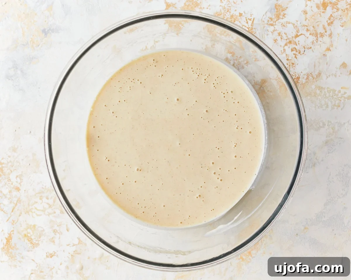 loose waffle batter in a glass bowl.