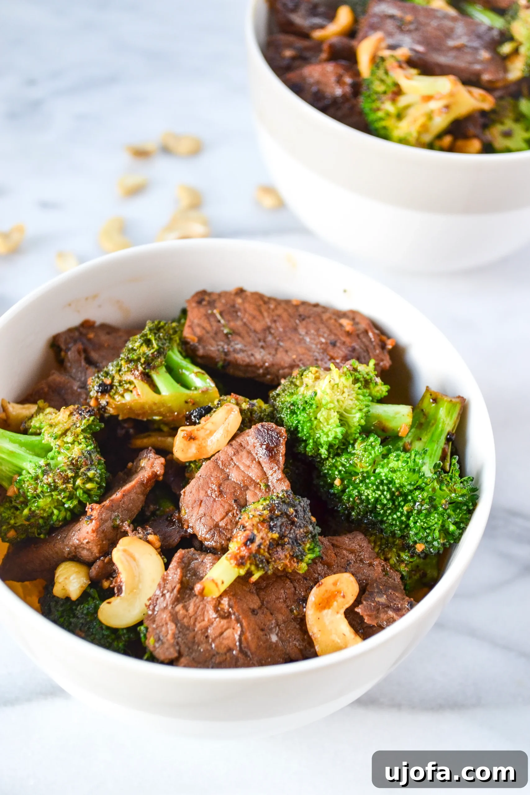 Delicious Beef and Broccoli stir-fry with cashews, served over cauliflower rice.