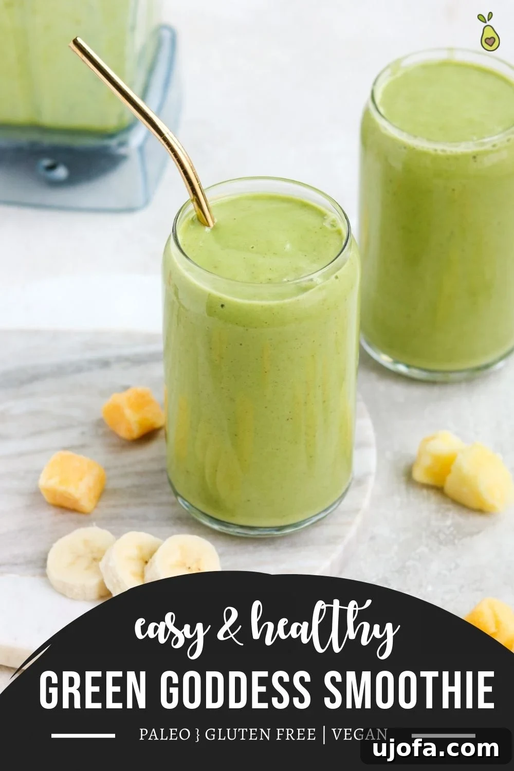 Paleo Green Goddess Elixir 6 A tall, slender image of a vibrant green breakfast smoothie in a glass with a straw, ready for Pinterest sharing