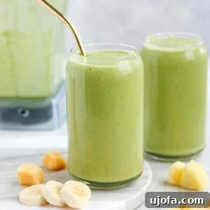 Tropical Green Smoothie with mango, banana, and pineapple