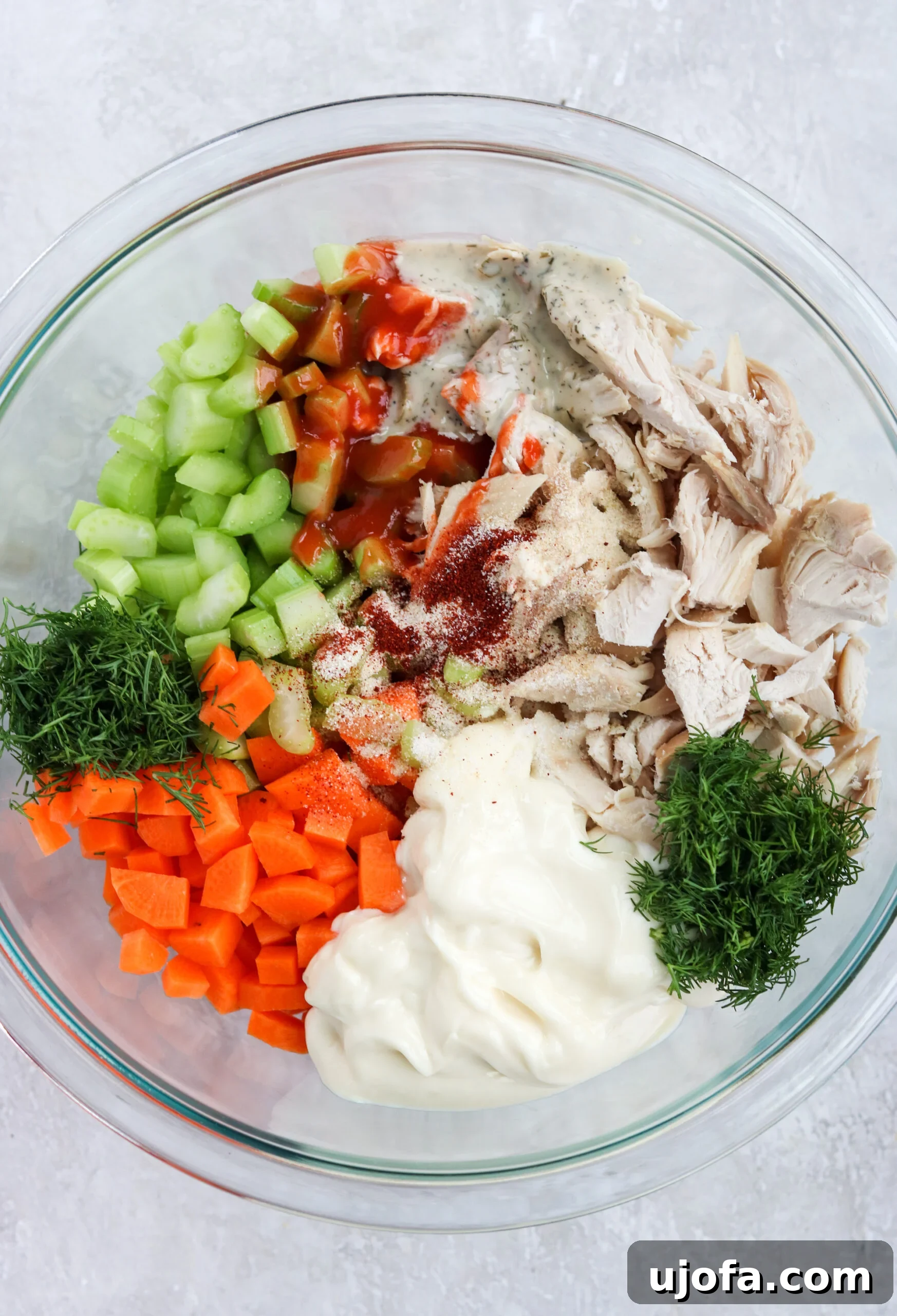 Buffalo Ranch Chicken Salad prepared and stored in a container for meal prep