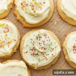 Simply Sweet Gluten-Free Cookies 6 Close up overhead view of gluten-free sugar cookies topped with frosting and sprinkles.
