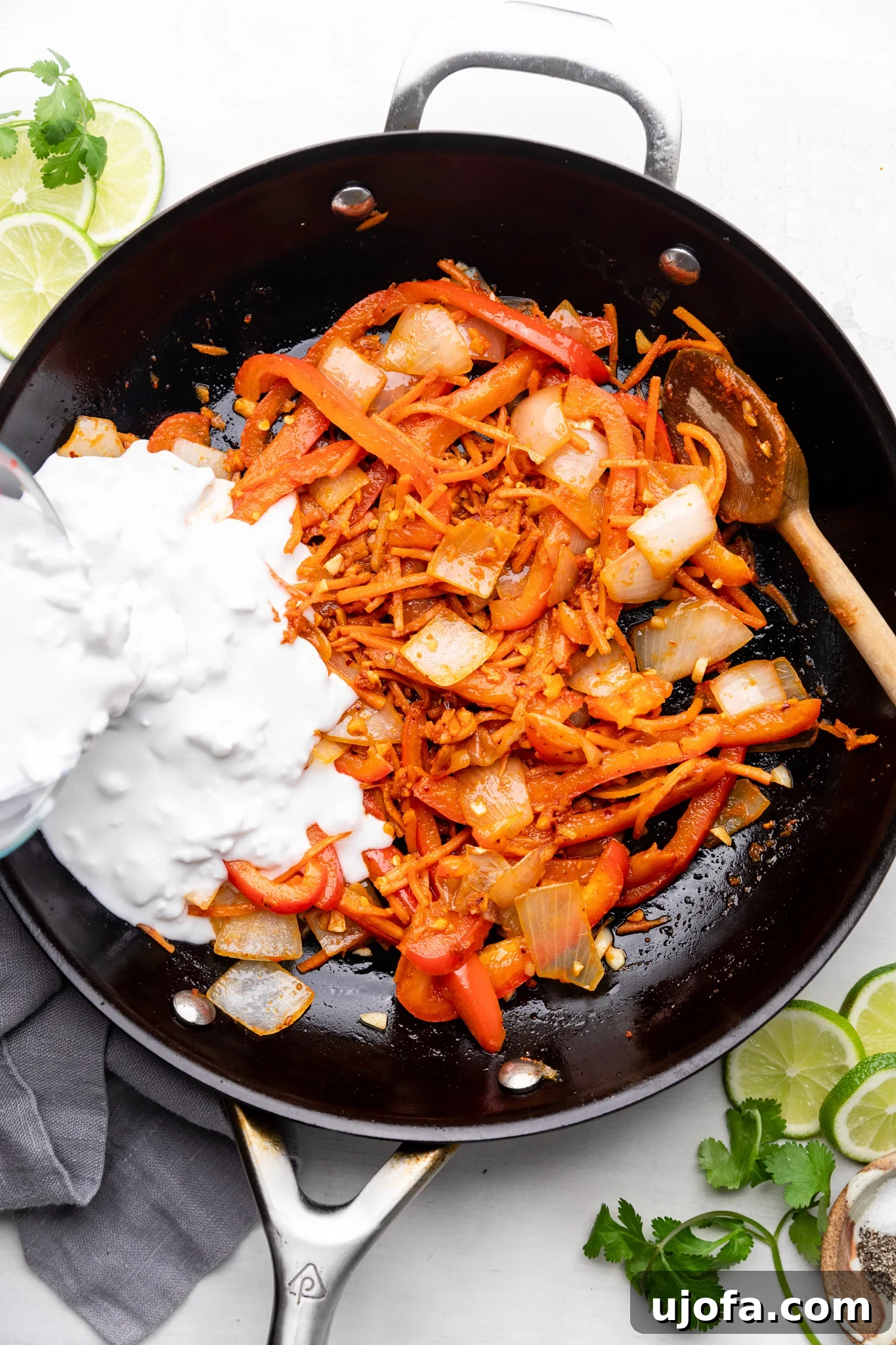 Savory Gluten-Free Thai Curry Salmon Ramen 4 Thai curry salmon ramen ingredients simmering in a black skillet