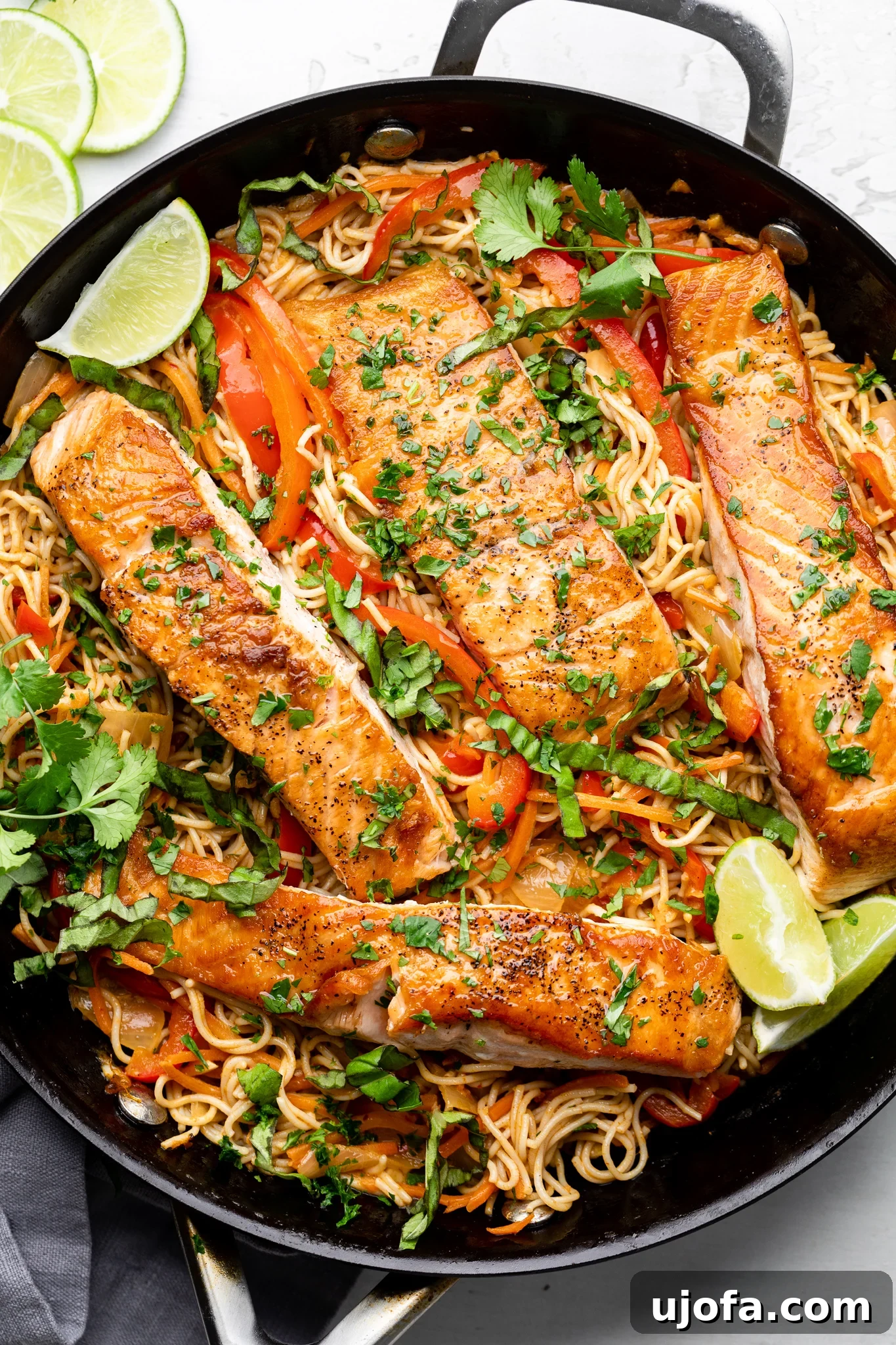 Savory Gluten-Free Thai Curry Salmon Ramen 6 Close-up of Gluten-Free Thai Curry Salmon Ramen in a black skillet