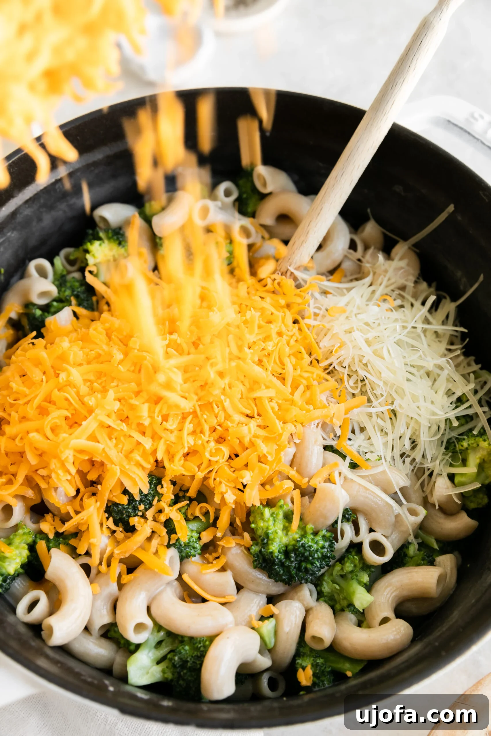 and large pot filled with the ingredients to make gluten-free mac and cheese