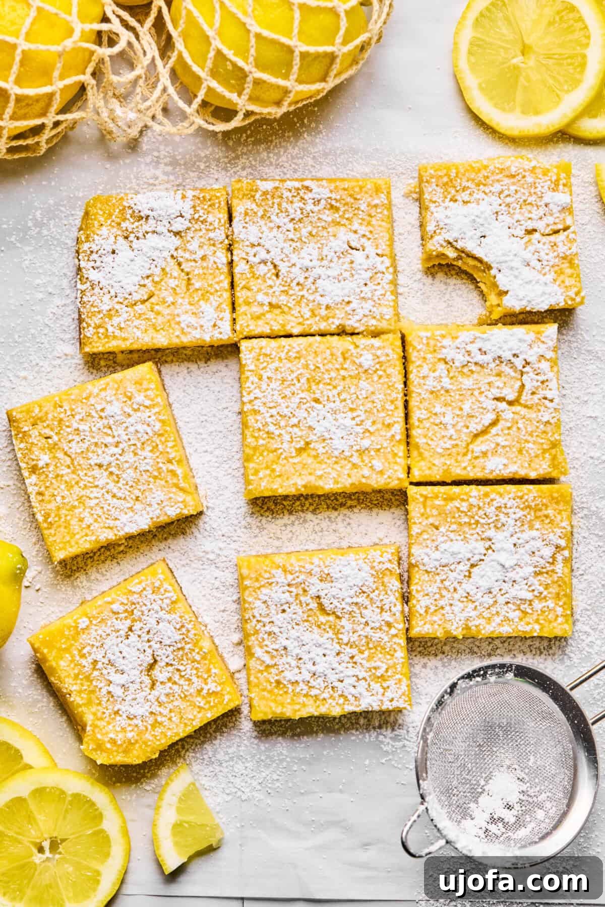 9 lemon bars dusted with powdered sugar