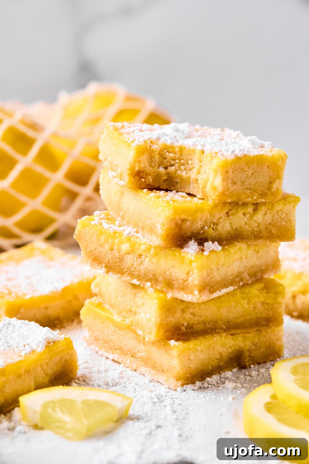 5 lemon bars stacked on top of each other