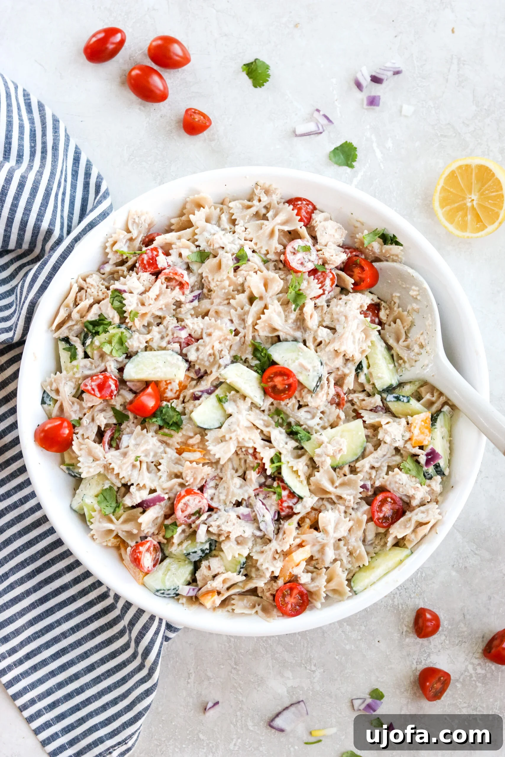 An overhead shot showcasing a vibrant gluten-free pasta salad, featuring tuna and fresh vegetables, presented in an inviting manner.