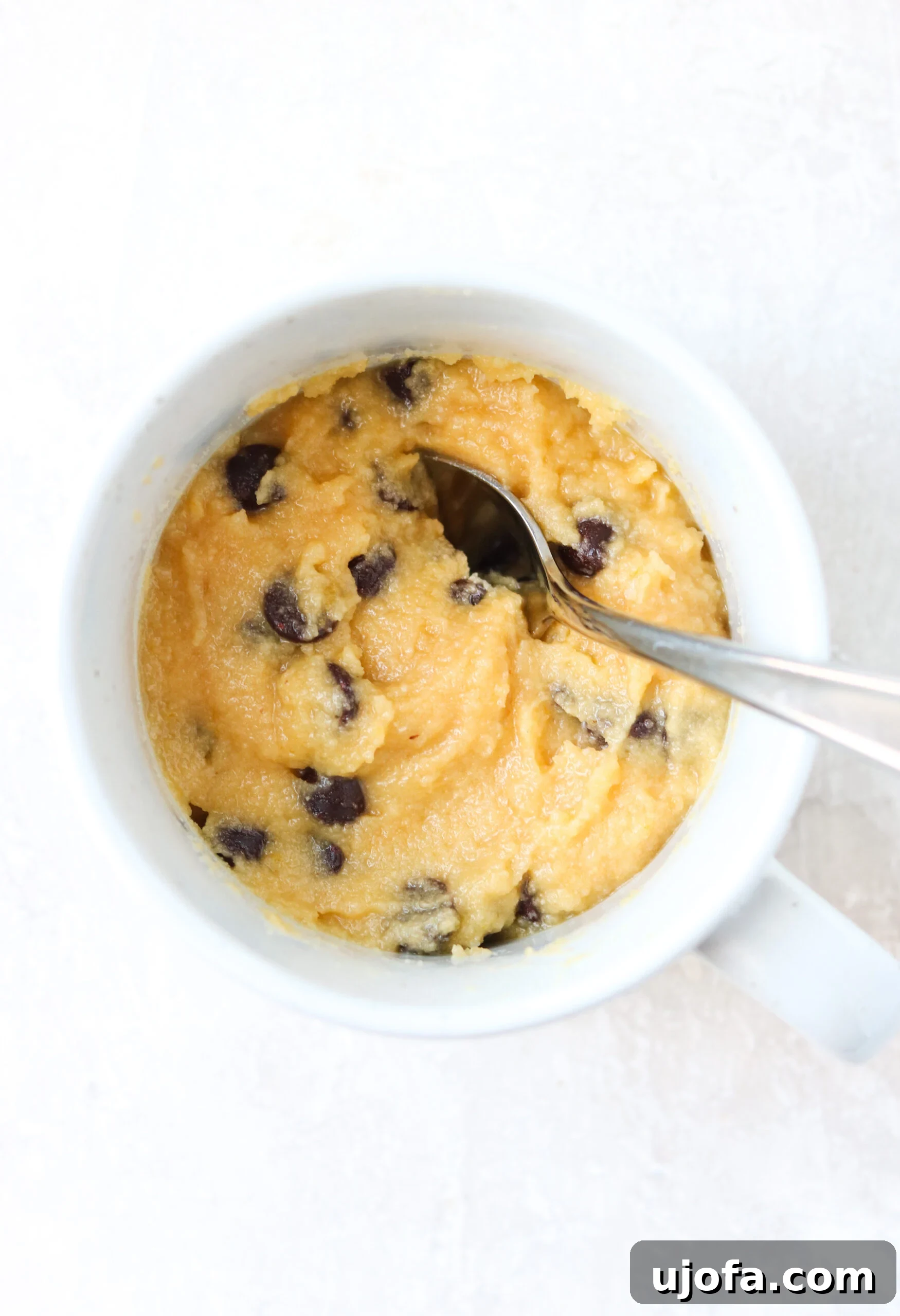 Raw gluten free mug cake batter in a cup