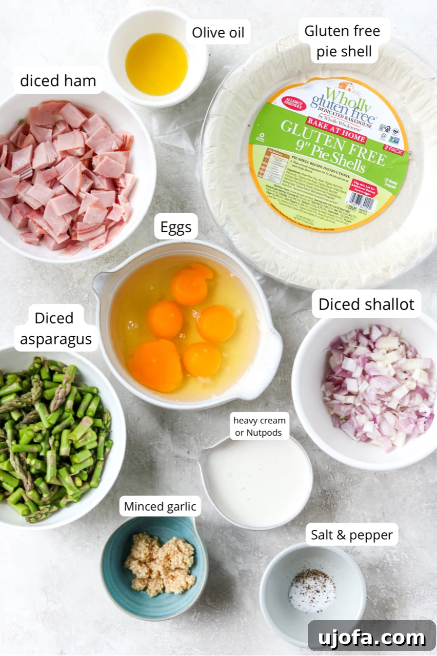 Ingredients for gluten free quiche with ham and asparagus, including eggs, NutPods, ham, and fresh asparagus