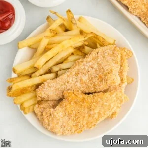 Flavorful Gluten-Free Chicken Feasts 7 Crispy golden-brown chicken tenders served on a plate, garnished with fresh parsley.