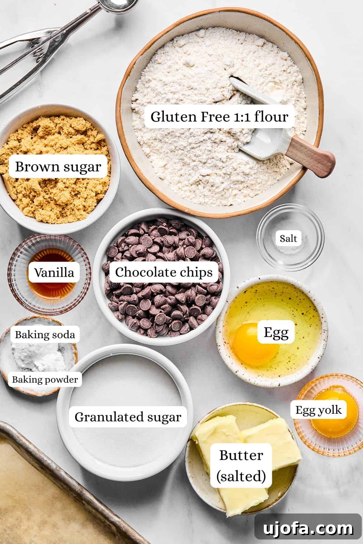 A collection of ingredients for gluten-free chocolate chip cookies neatly arranged in nesting bowls.