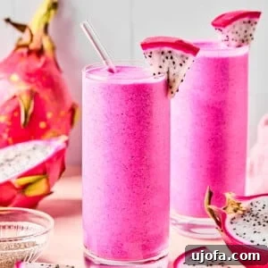 Dragonfruit Power-Up Smoothie 9 dragon fruit smoothies in 2 cups surrounded by dragonfruit pieces