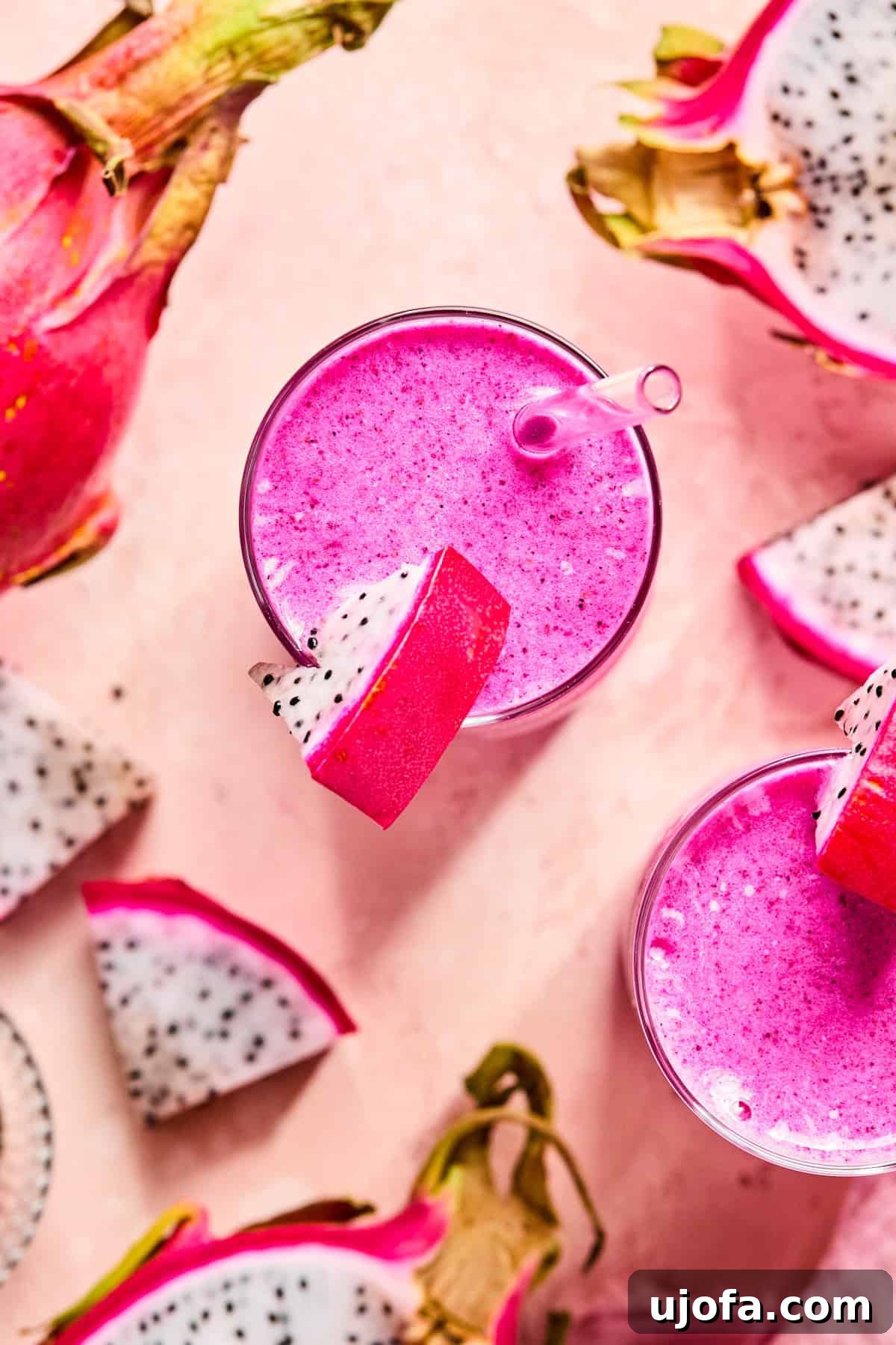 Dragonfruit Power-Up Smoothie 8 Bird’s eye view of a bright pink dragonfruit smoothie topped with a slice of dragonfruit on the rim of the glass.