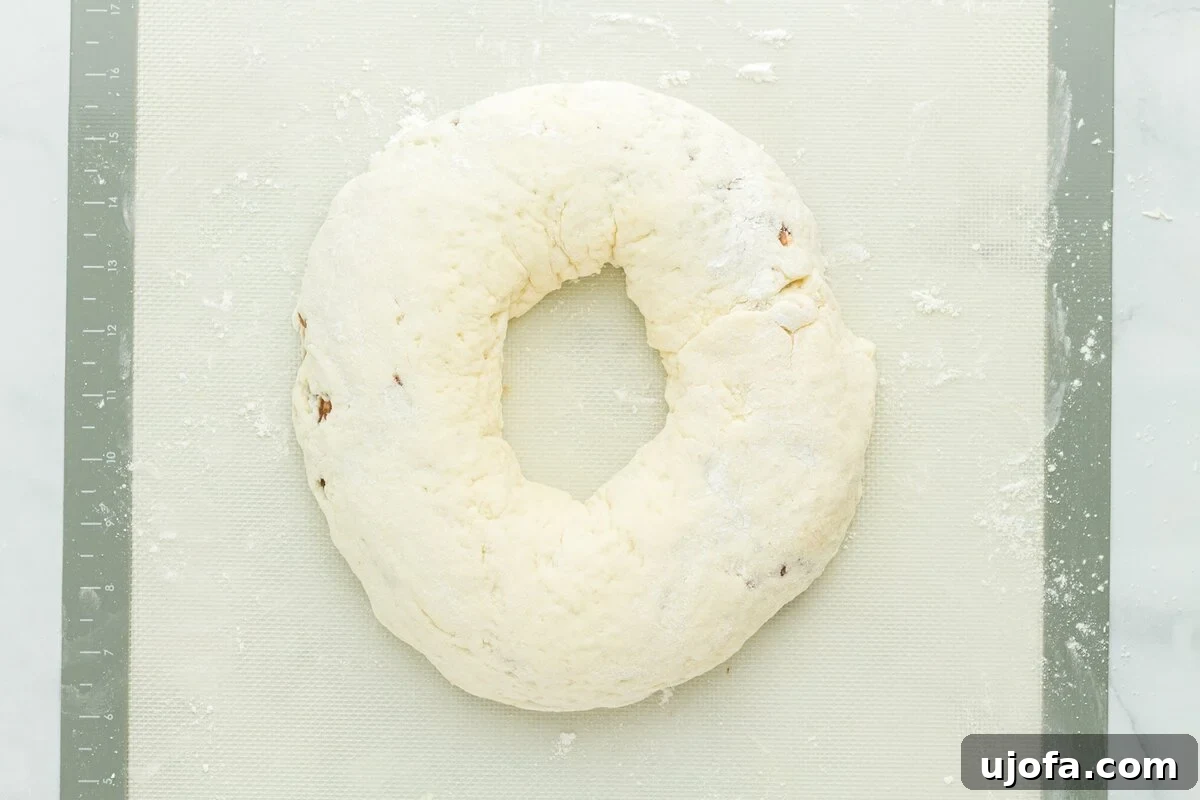 Mardi Gras Magic: Gluten-Free King Cake 12 Gluten free king cake dough shaped into a ring on a floured silicone mat before baking.