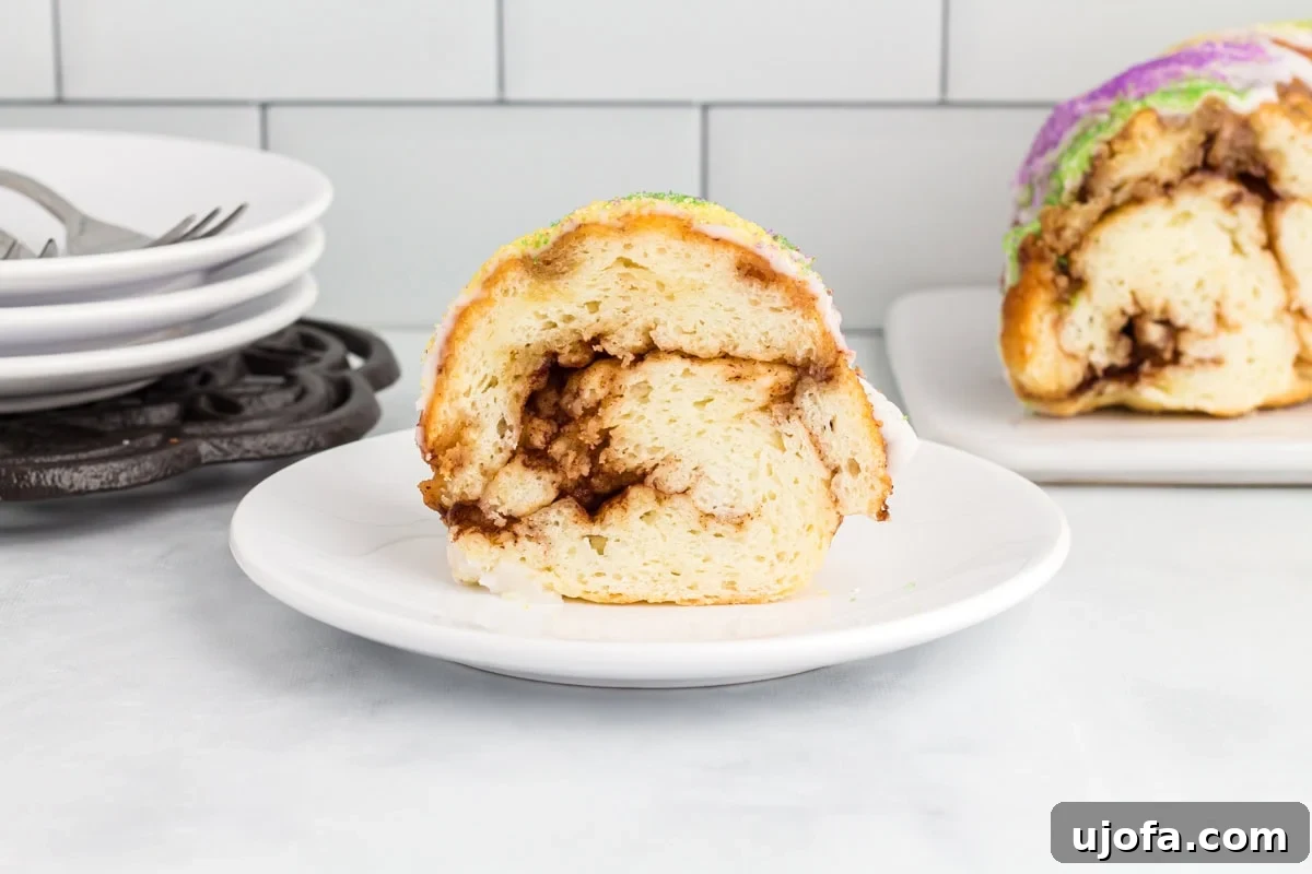 Mardi Gras Magic: Gluten-Free King Cake 18 Slice of gluten free king cake showing the cinnamon swirl filling and fluffy bread texture.
