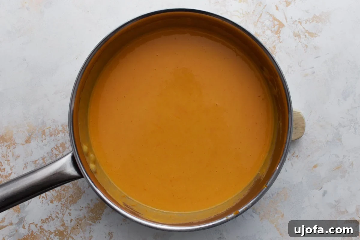 finished gluten-free beer cheese sauce in a saucepan
